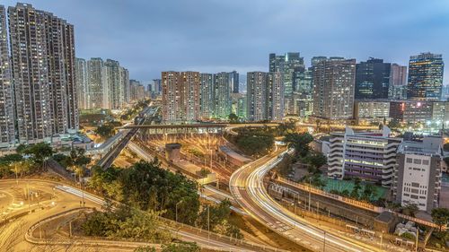 High angle view of traffic on road amidst buildings in city