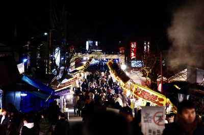 High angle view of people on street at night