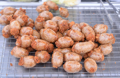 High angle view of meat on barbecue grill