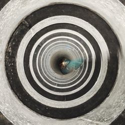 High angle view of man standing on spiral staircase