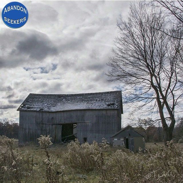 building exterior, sky, architecture, built structure, cloud - sky, bare tree, tree, cloudy, communication, text, day, cloud, no people, outdoors, western script, house, low angle view, field, overcast, nature