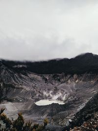 Scenic view of volcanic landscape against sky