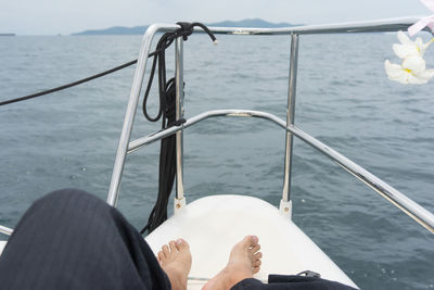 Low angle view of person sailing on sea