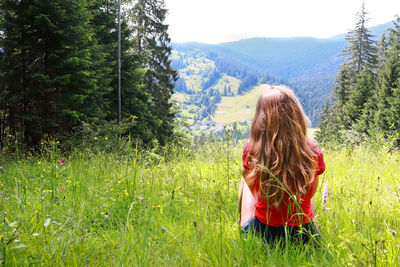 Rear view of woman in forest