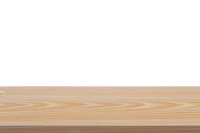 Surface level of wooden floor against white background