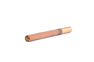 Close-up of cigarette against white background