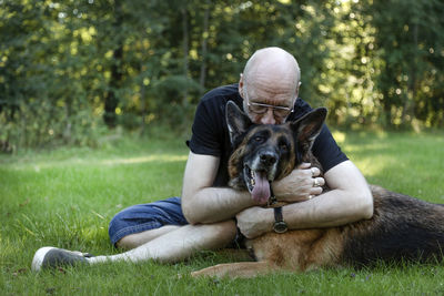 Man hugging dog