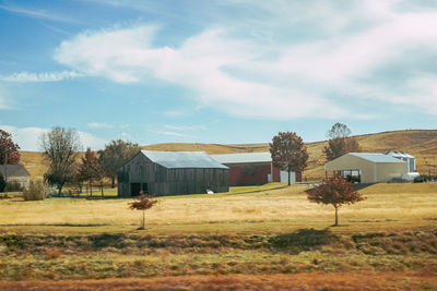 House on field against sky