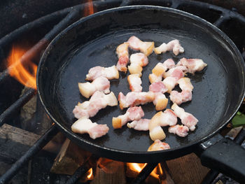 High angle view of meat on barbecue grill