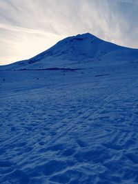 Scenic view of snow covered mountain against sky