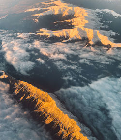 Aerial view of snowcapped mountain against sky