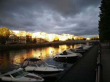 Boats moored on sea against sky