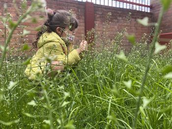 Side view of woman on grassy field