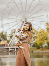 Woman with umbrella in amusement park