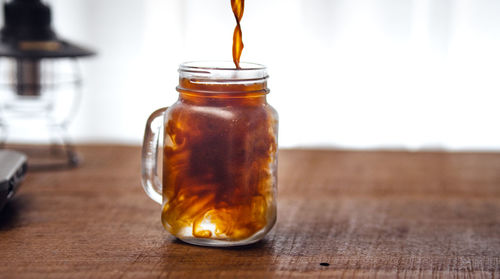 Close-up of drink in jar on table