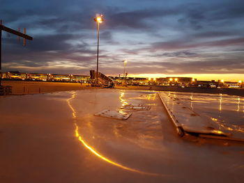 Illuminated lisbon portela airport against sky