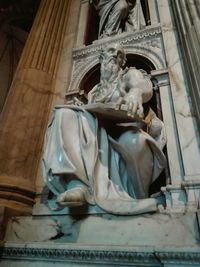 Low angle view of statue against building