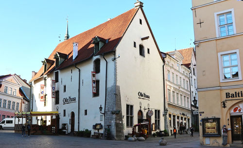 Street amidst buildings in city against sky