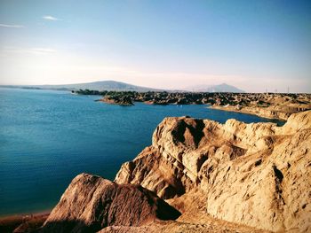 Scenic view of sea and rocks against sky