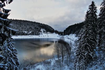 Frozen lake against sky during winter