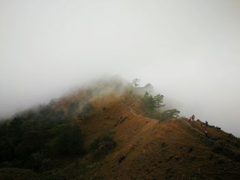 Scenic view of mountains in foggy weather