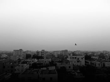 High angle view of buildings in city against clear sky