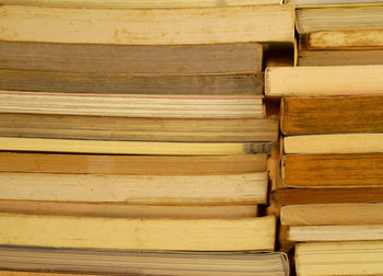 Full frame shot of stacked books in library
