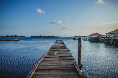 Pier over sea against sky