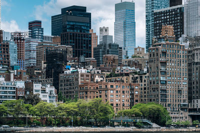 Buildings in city against sky