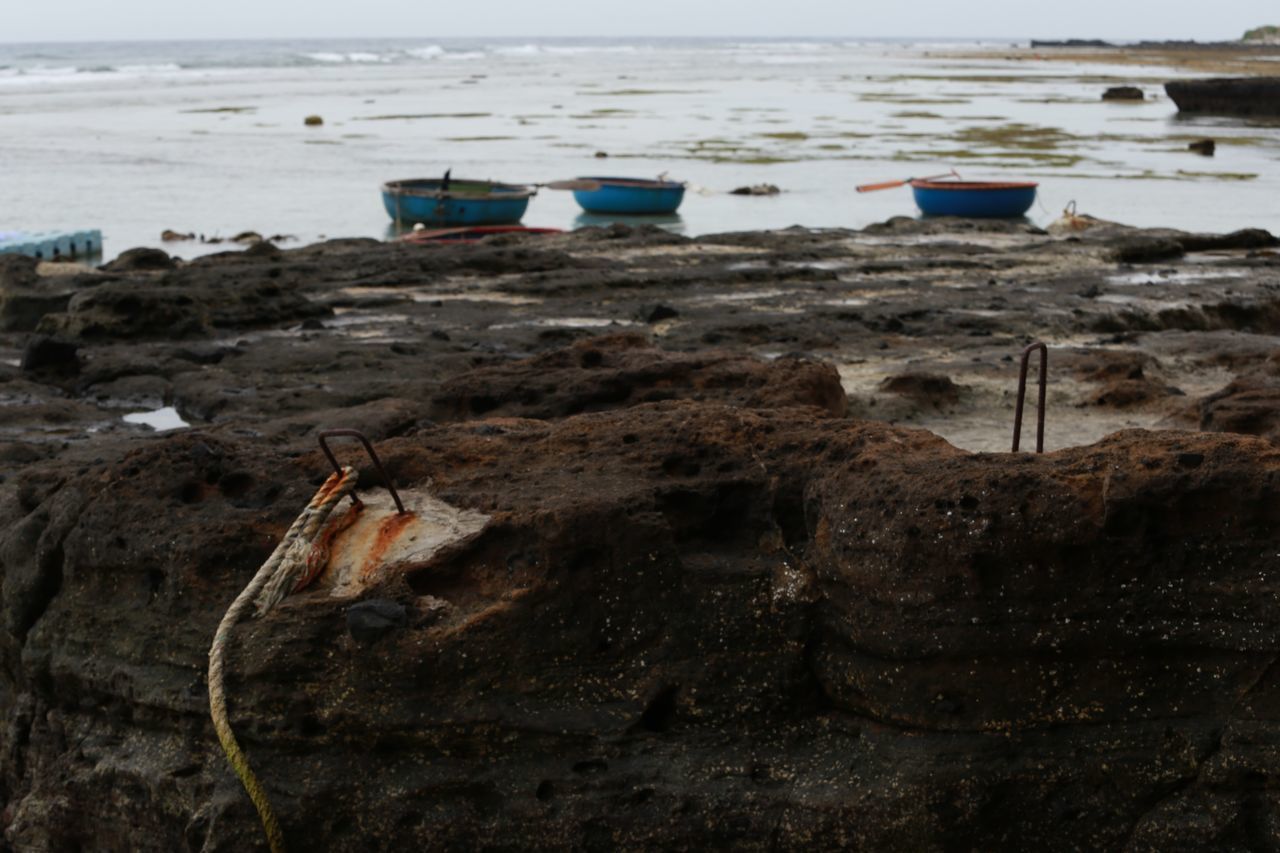 VIEW OF ROCK ON BEACH