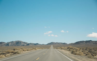 Empty road against sky