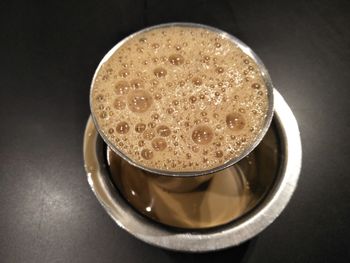 High angle view of coffee cup on table