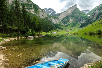 Scenic view of lake with mountains in background