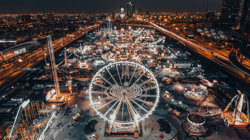 High angle view of illuminated buildings in city at night