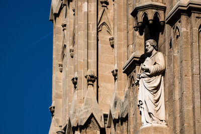 Low angle view of statues on building