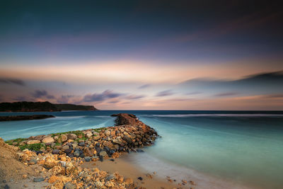 Scenic view of sea against sky during sunset