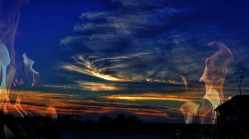 Silhouette of landscape against dramatic sky