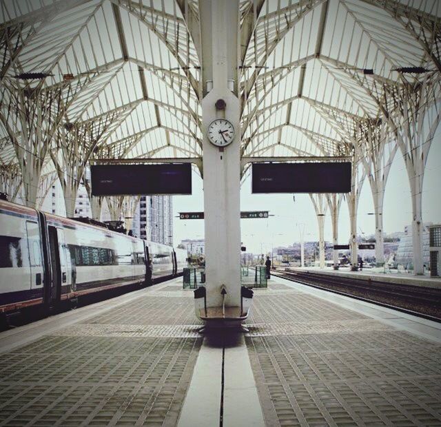 built structure, architecture, transportation, railroad station, indoors, railroad station platform, public transportation, ceiling, empty, the way forward, rail transportation, travel, architectural column, incidental people, modern, railroad track, day, transportation building - type of building, interior, diminishing perspective