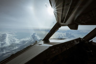 Tilt image of airplane window during winter