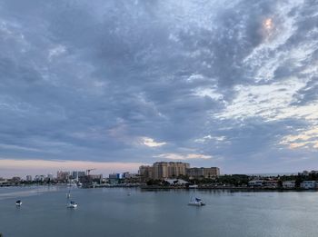 View of boats in sea against buildings