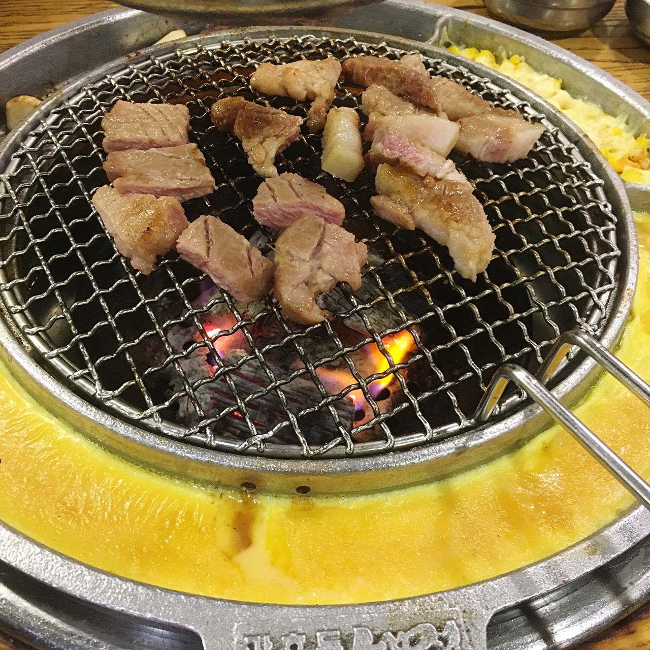 CLOSE-UP OF MEAT IN BARBECUE