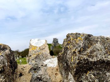 Low angle view of rock formation against sky