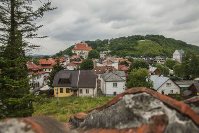 Houses in town against sky