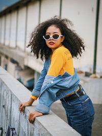 Portrait of young woman wearing sunglasses