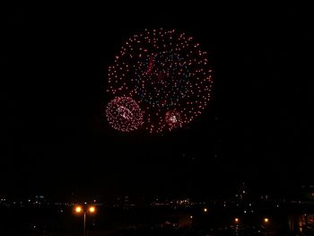 Firework display at night