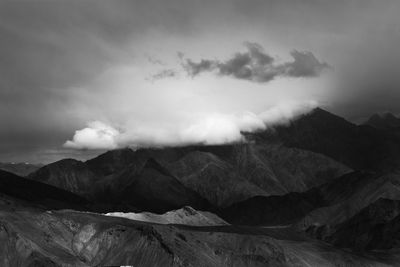 View of mountain range against cloudy sky