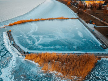 High angle view of swimming pool by sea