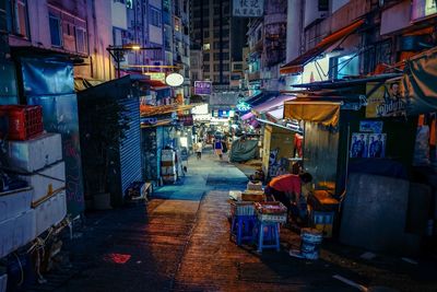 Narrow alley along city street