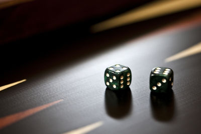 Close-up of dices on wooden table