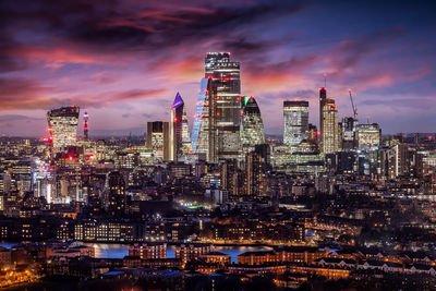 Illuminated buildings against sky